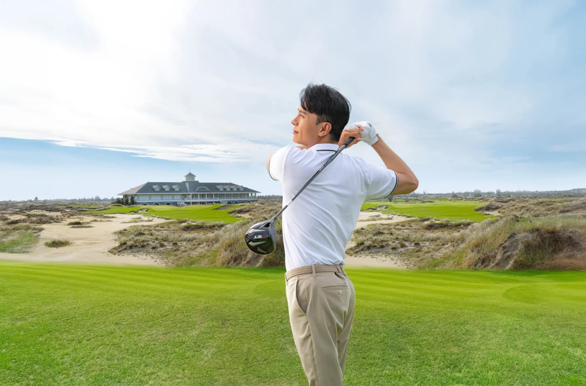 Golfer swinging at Hoiana Shores